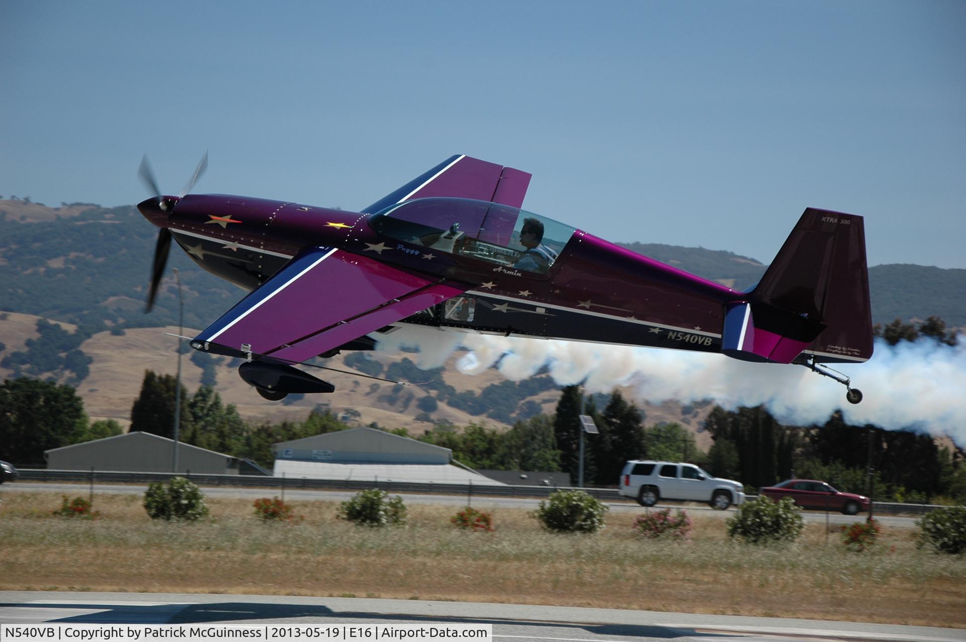 N540VB, Extra EA-300 C/N 033, Armin taking off in the Extra 300 from RWY 32 with smoke on.