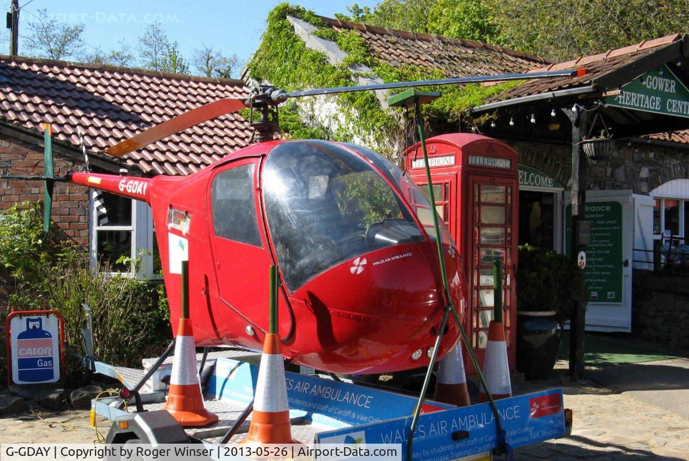 G-GDAY, 1987 Robinson R22 Beta C/N 0676, Off airport. De-registered on 28th September 1999 the airframe was restored in 2012 as a travelling promotional fund raiser by the Wales Air Ambulance charity. Seen at a fund raising event held at the Gower Heritage Centre, Parkmill, Swansea, Wales, UK.