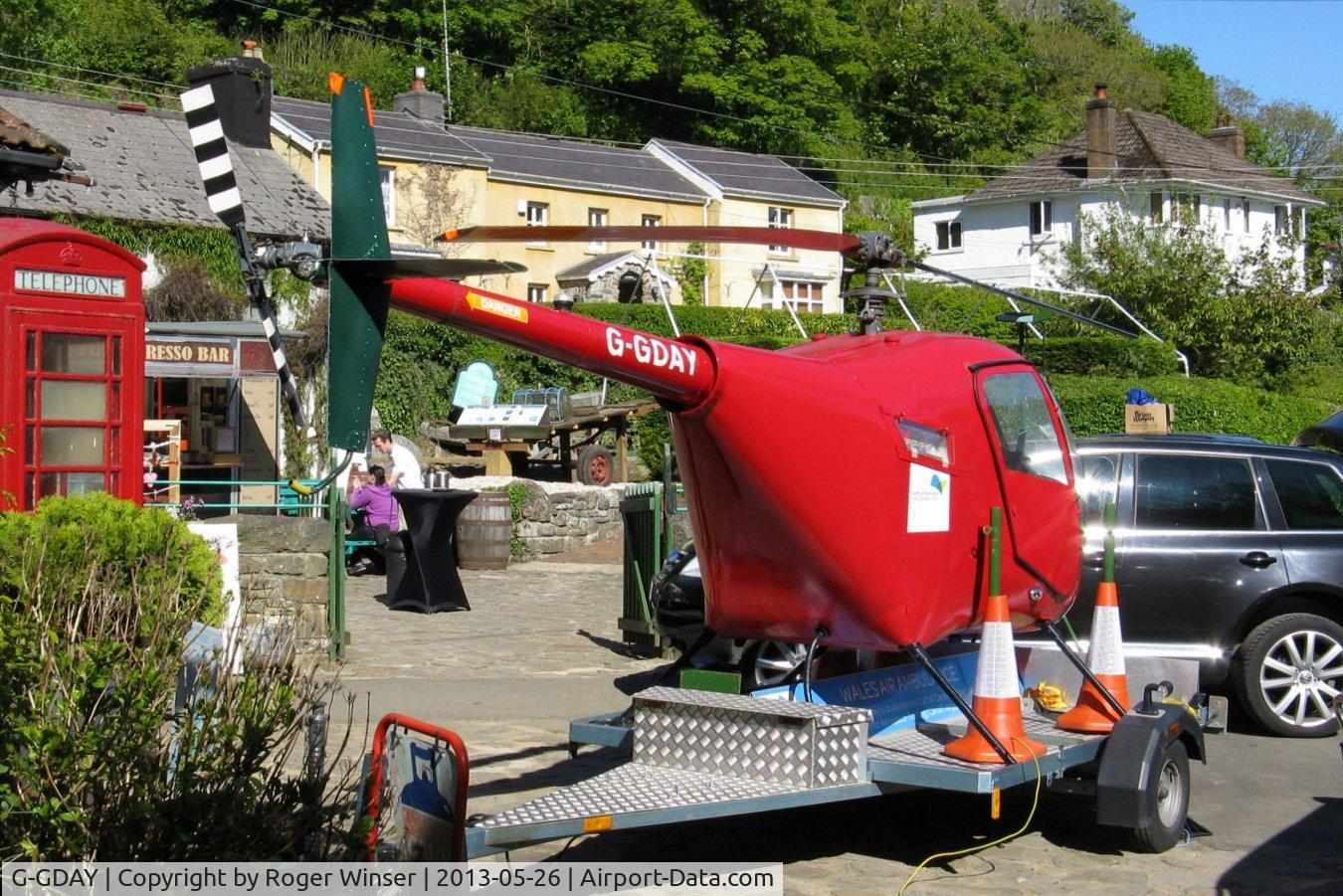 G-GDAY, 1987 Robinson R22 Beta C/N 0676, Off airpot. De-registered on 28th September 1999 the airframe was restored in 2012 as a travelling promotional fund raiser by the Wales Air Ambulance charity. Seen at a fund raising event held at the Gower Heritage Centre, Parkmill, Swansea, Wales, UK.