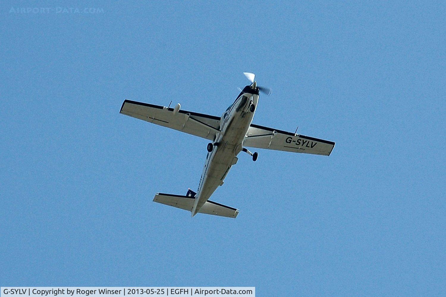 G-SYLV, 2002 Cessna 208B  Grand Caravan C/N 208B0936, Skydive Swansea's Grand Caravan climbing out over the airport for drops from 7500 feet and 12000 feet.