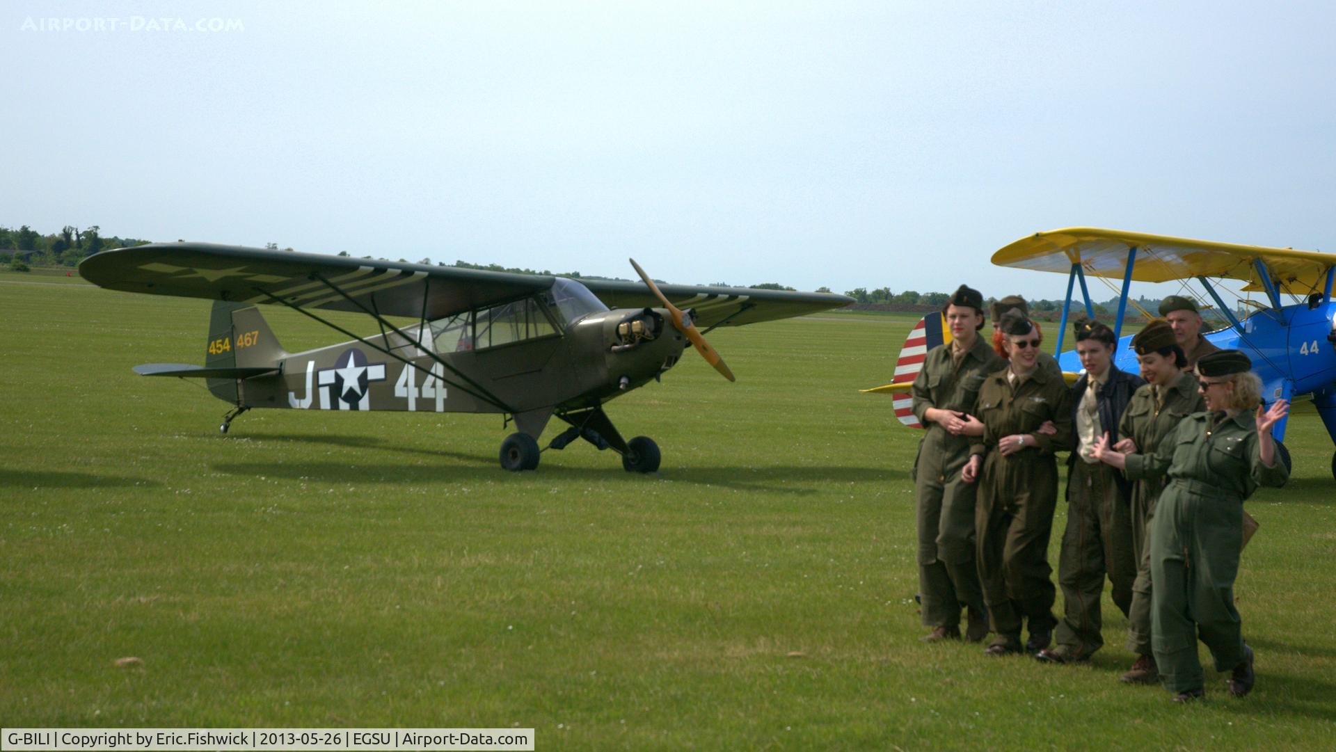 G-BILI, 1948 Piper L-4J Grasshopper (J3C-65D) C/N 13207, 5. 454467 with a brilliant group of 're-enactors' at the IWM Spring Airshow, May 2013.