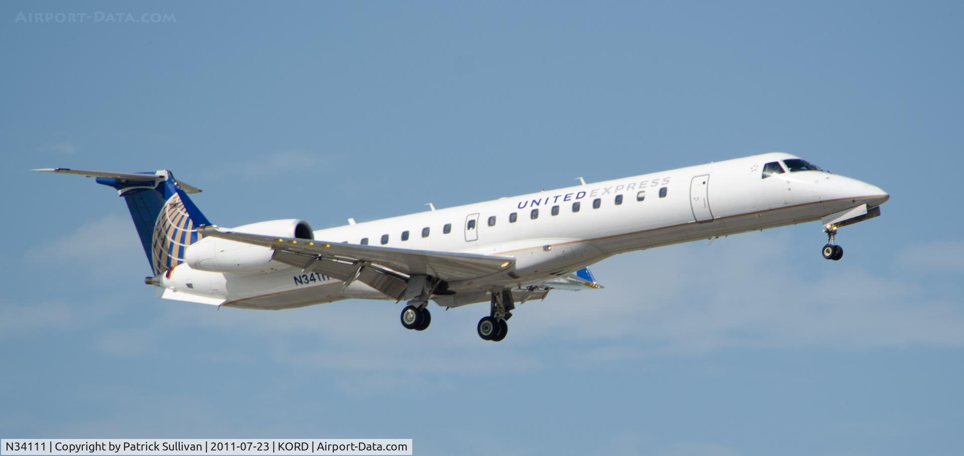 N34111, 2002 Embraer ERJ-145XR (EMB-145XR) C/N 145659, Landing Chicago O'Hare 14R