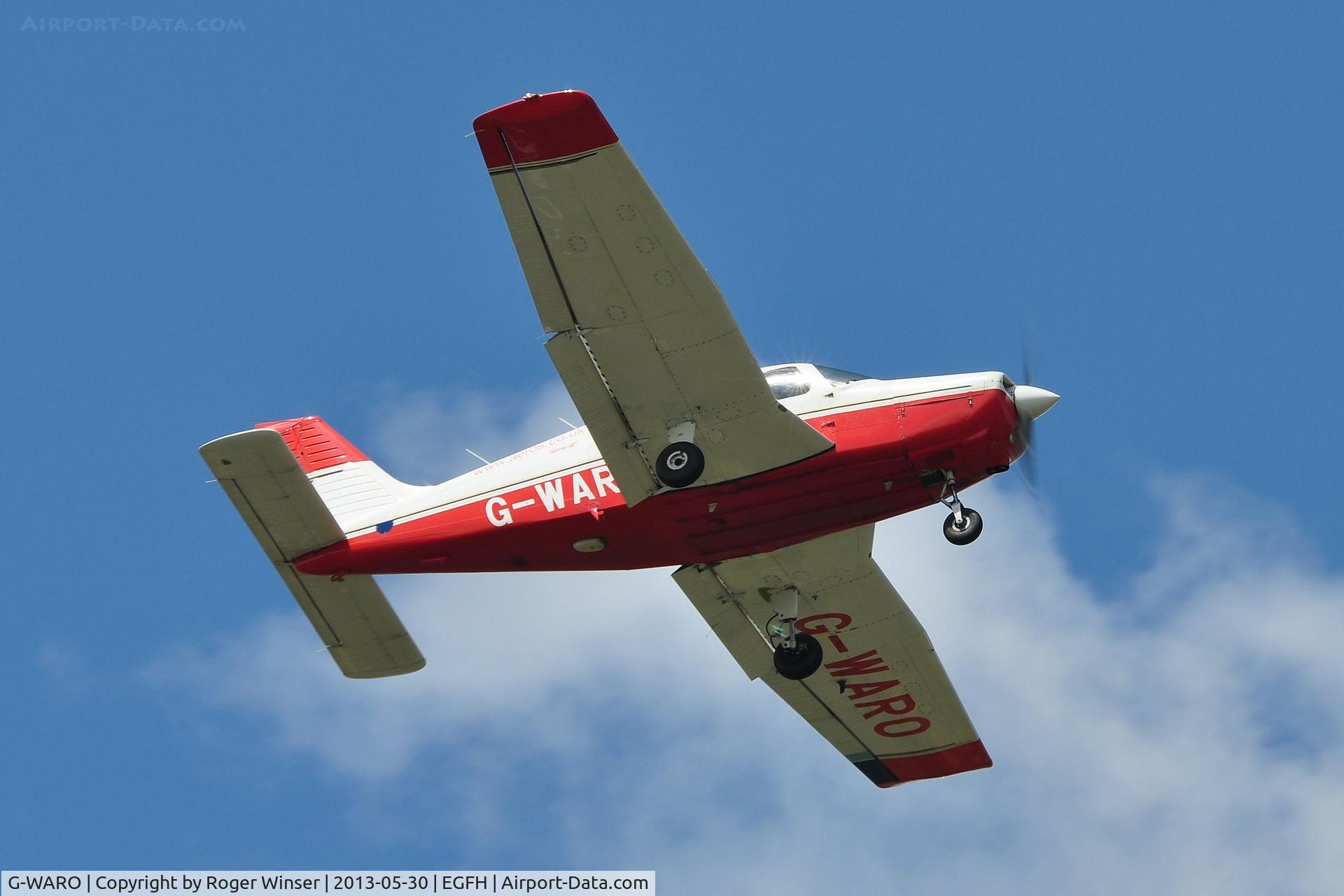 G-WARO, 1997 Piper PA-28-161 Cherokee Warrior III C/N 28-42015, Visiting Cherokee Warrior III operated by Aeros Flight Training climbing out after a touch and go.