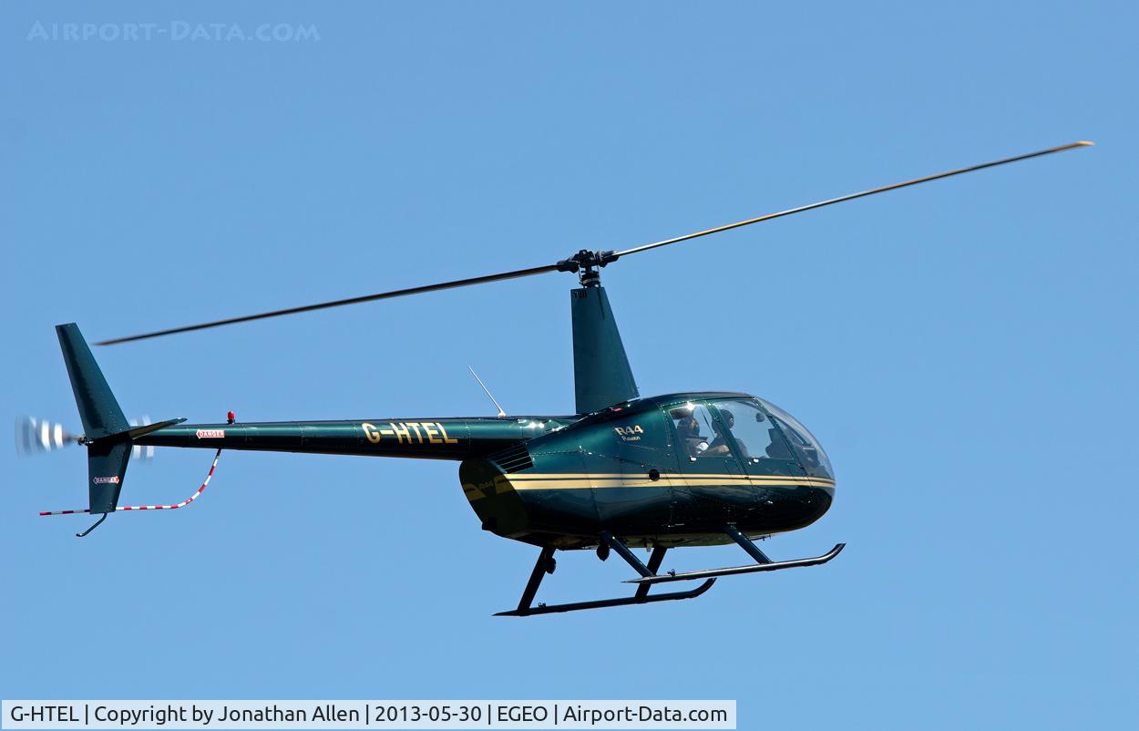 G-HTEL, 2002 Robinson R44 Raven C/N 1155, About to land at Oban Airport.