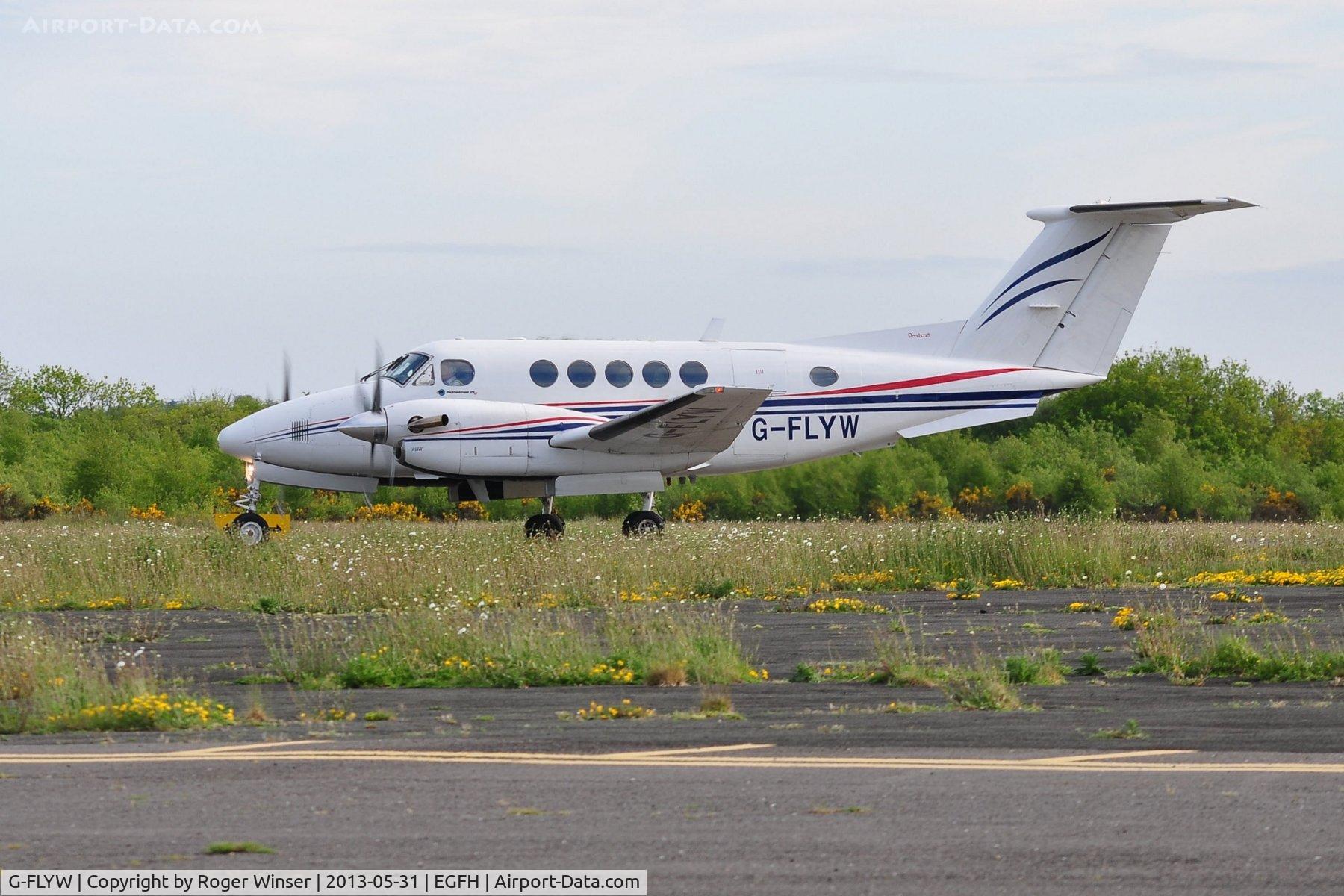 G-FLYW, 1977 Beech 200 Super King Air C/N BB-209, Super King Air of Haverfordwest based FlyWales bringing particiants in the Heroes Challenge UK fund raising cycle ride to the airport. Registered G-LIVY between 24 March 2011 and 17 December 2012.