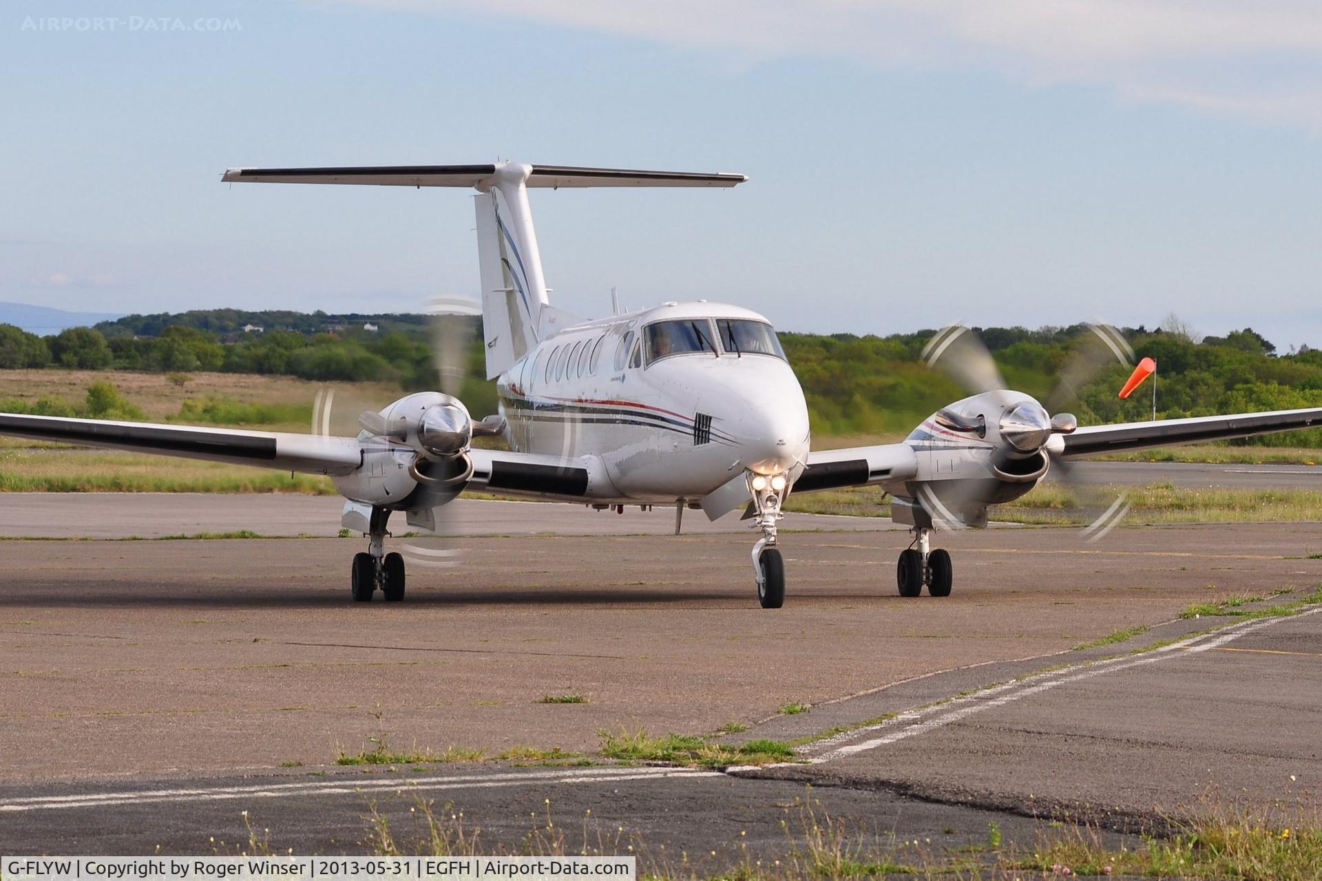 G-FLYW, 1977 Beech 200 Super King Air C/N BB-209, Super King Air operated by Haverfordwest based FlyWales bringing participants in the Heroes Challenge UK fund raising cycle ride to Swansea Airport. Registered G-LIVY between 24 March 2011 and 17 December 2012.