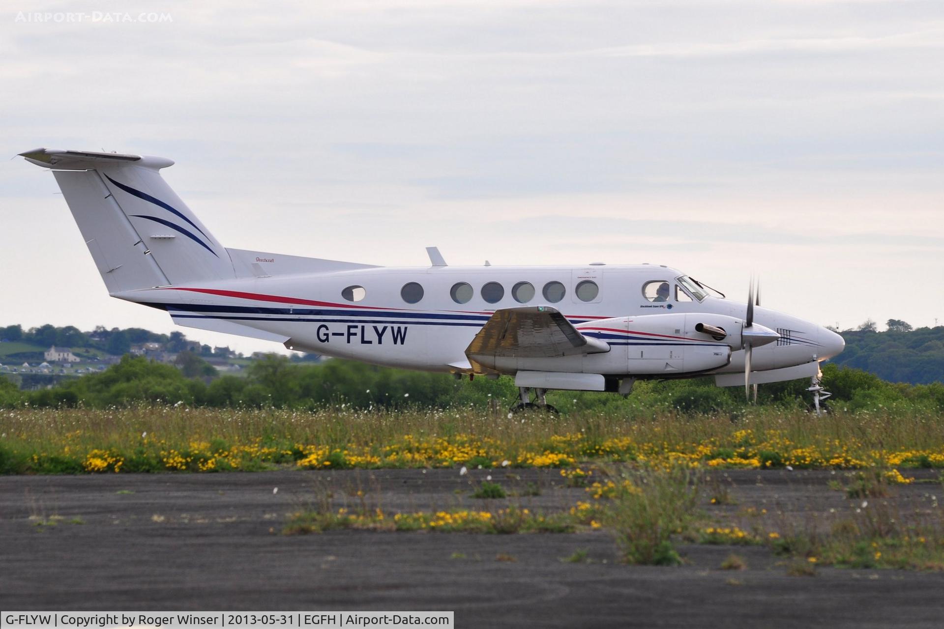 G-FLYW, 1977 Beech 200 Super King Air C/N BB-209, Visiting Super King Air operated by FlyWales about to depart to Haverfordwest after droping off participants in the Heroes Challenge UK fund raising cycle ride. Registered G-LIVY between 24 March 2011 and 17 December 2012.