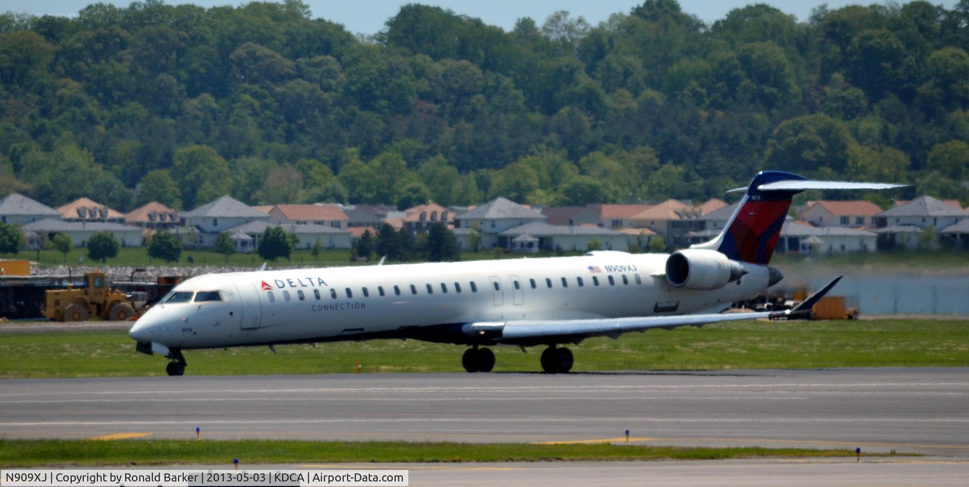 N909XJ, 2007 Bombardier CRJ-900ER (CL-600-2D24) C/N 15141, Takeoff DCA