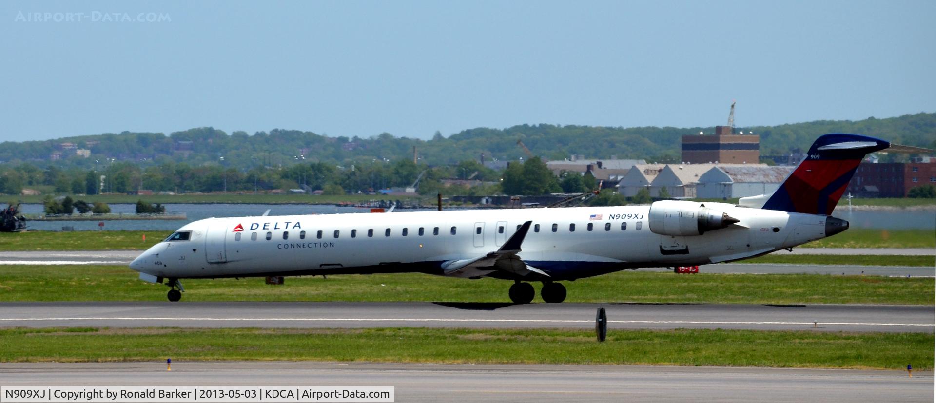 N909XJ, 2007 Bombardier CRJ-900ER (CL-600-2D24) C/N 15141, Nose wheell liftoff  - Takeoff  DCA