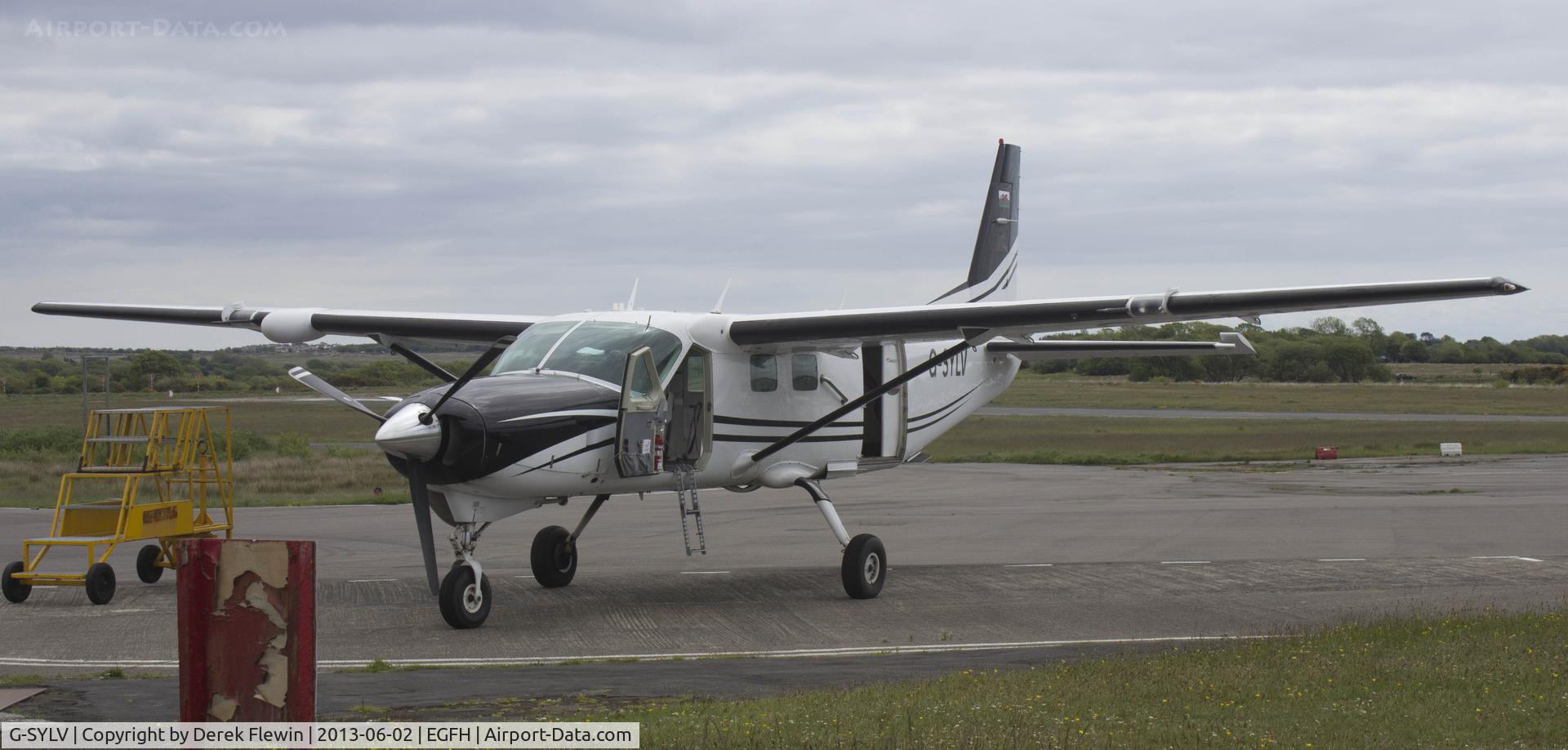 G-SYLV, 2002 Cessna 208B  Grand Caravan C/N 208B0936, Sylvia waiting for the clouds to clear for another lift.