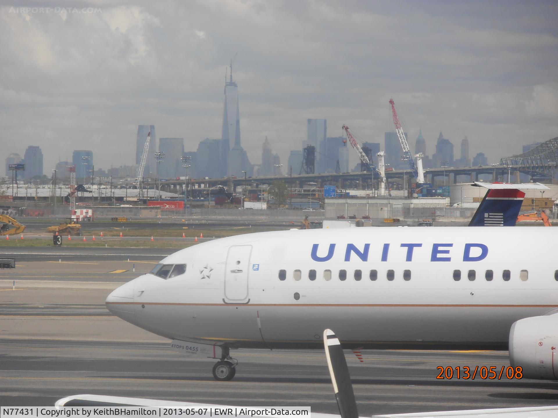 N77431, 2009 Boeing 737-924/ER C/N 32833, N77431 Nose with New York skyline in the background