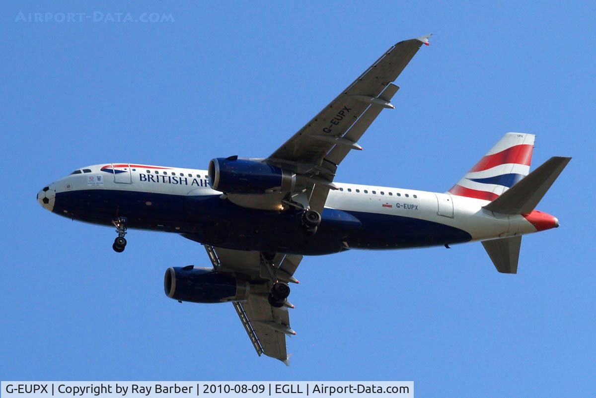 G-EUPX, 2001 Airbus A319-131 C/N 1445, Airbus A319-131 [1445] (British Airways) Home~G 09/08/2010 On approach 27R with football colouring on nose for 2010 World Cup and 2 posters below the cockpit.