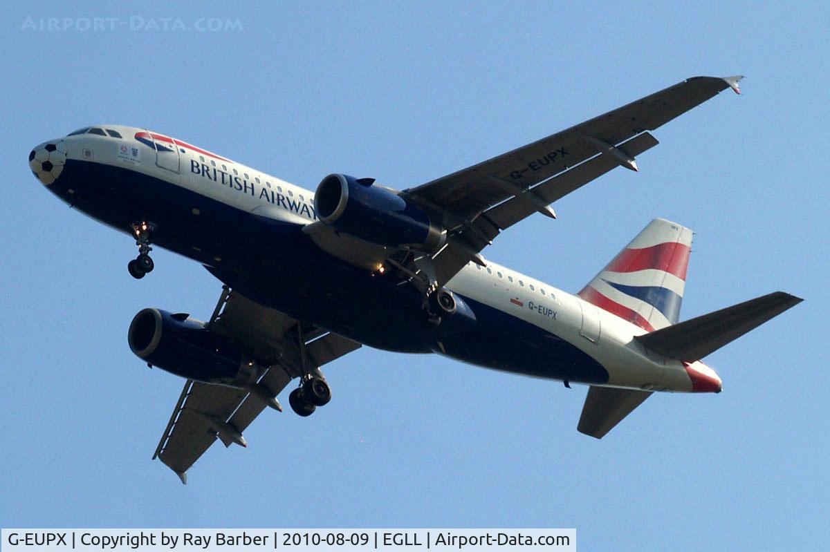 G-EUPX, 2001 Airbus A319-131 C/N 1445, Airbus A319-131 [1445] (British Airways) Home~G 09/08/2010 On approach 27R with football colouring on nose for 2010 World Cup and 2 posters below the cockpit.