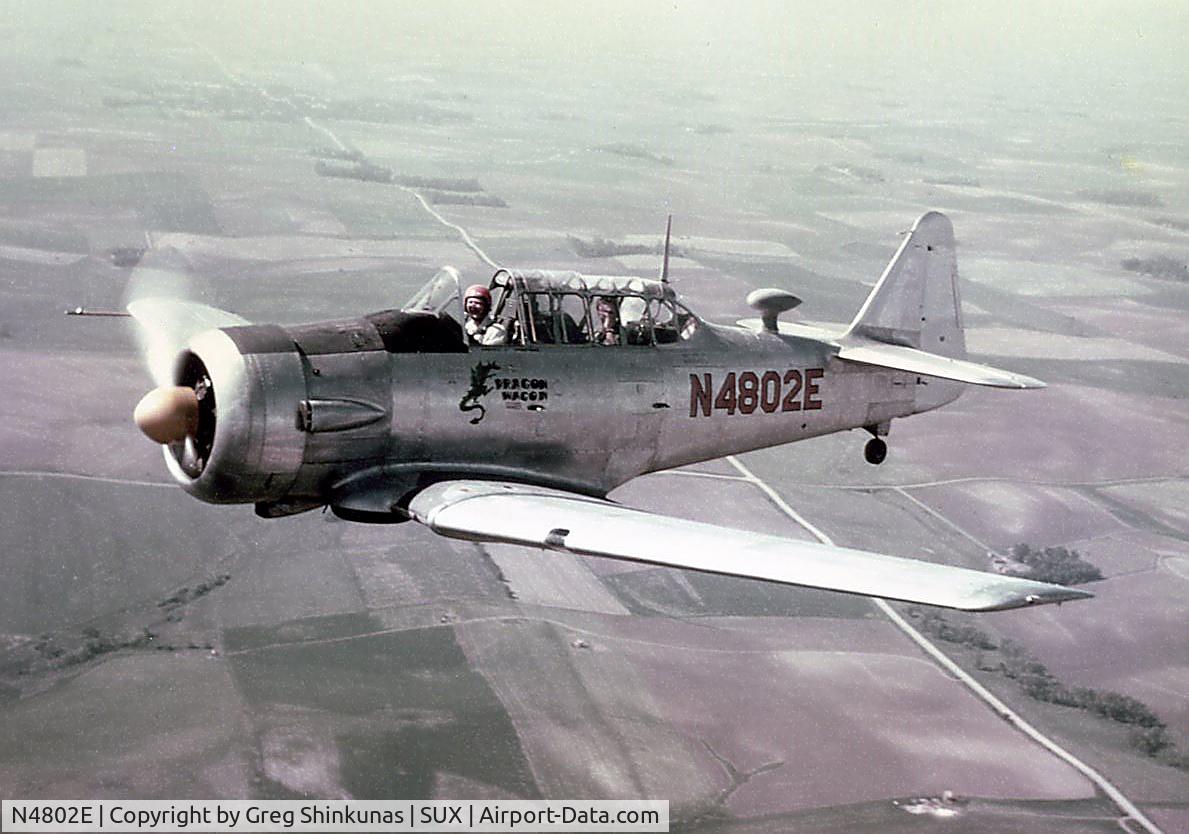 N4802E, 1961 North American AT-6A Texan C/N AJ-968, Photographed in flight West of Sioux City Municipal Airport (now Sioux Gateway airport), around 1964.  Pilot/Owner at that time was John J. Shinkunas.