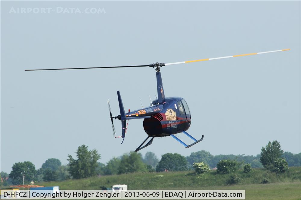 D-HFCZ, Robinson R44 C/N Not found D-HFCZ, Funny colored heli (backside)....