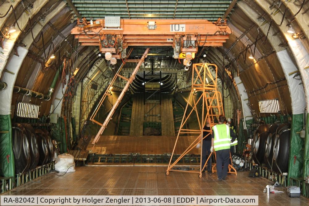 RA-82042, 1991 Antonov An-124-100 Ruslan C/N 9773054055093/0606, Now we are in very back area. Notice the spare wheel on both sides.....