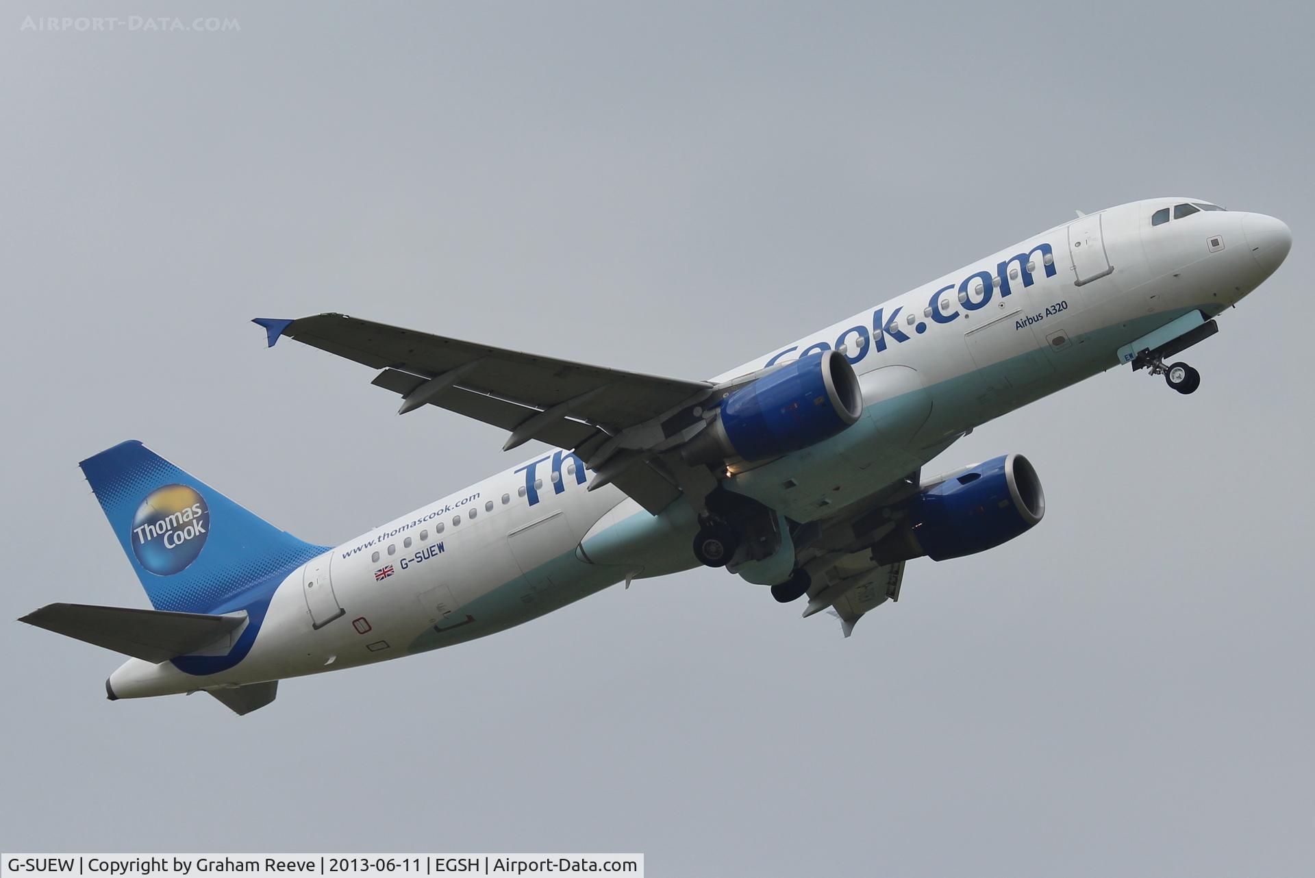 G-SUEW, 2003 Airbus A320-214 C/N 1961, Gear being retracted.