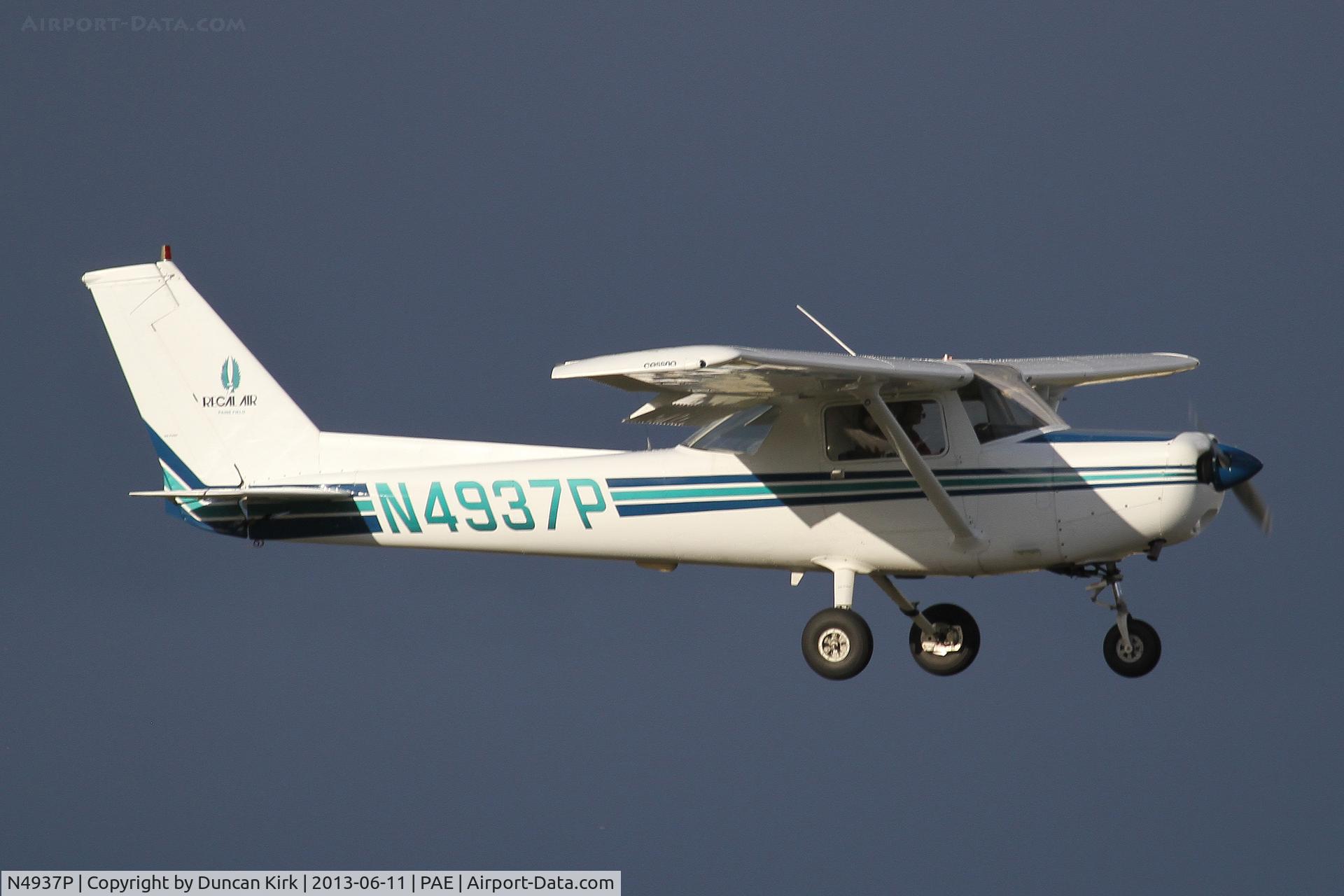 N4937P, 1981 Cessna 152 C/N 15284849, One of Regal Air's Cessna 152's landing with a mean black sky back ground