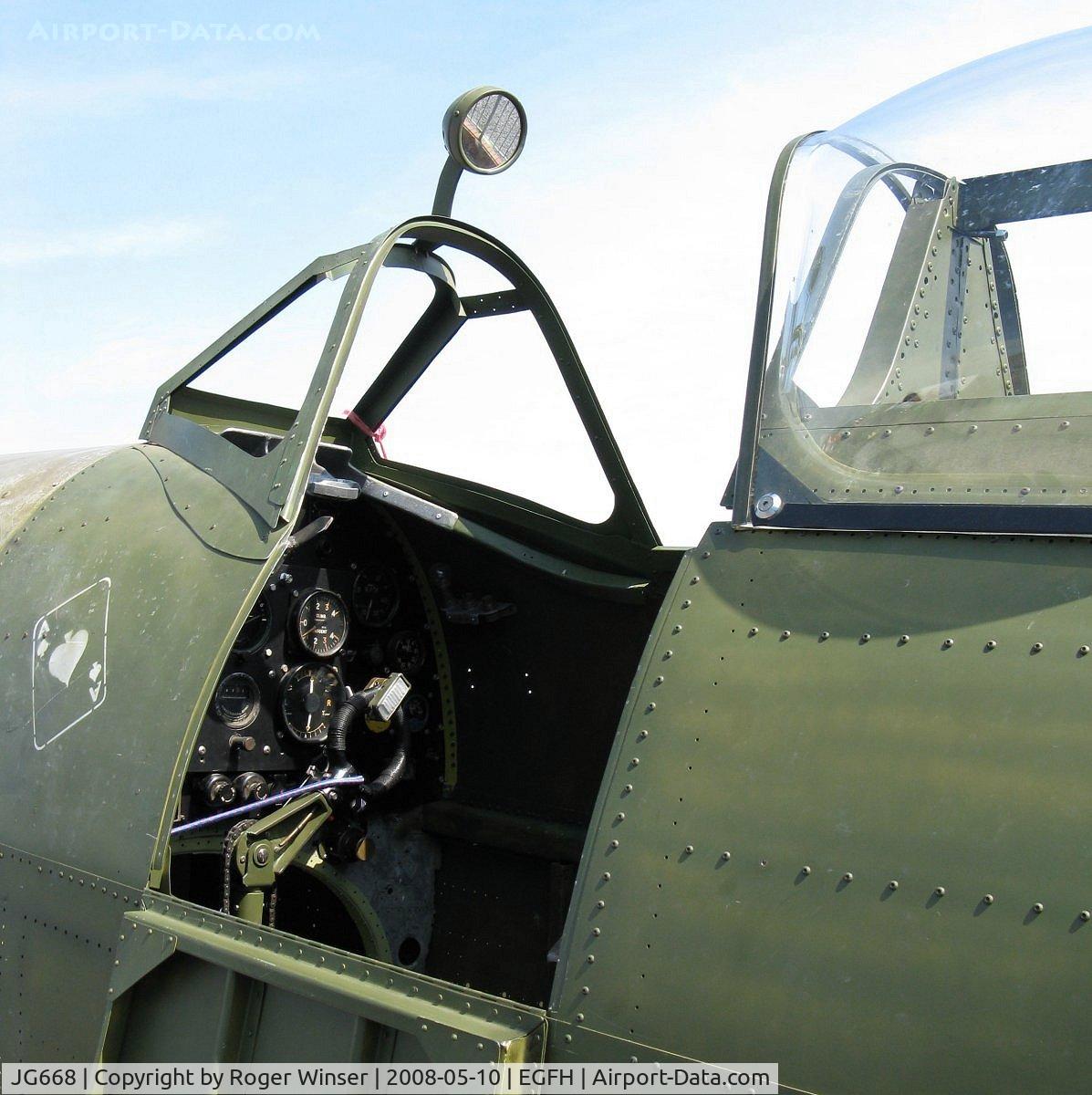 JG668, 1944 Supermarine 361 Spitfire LF.VIII C/N Not found JG668, Spitfire VIII fuselage on display at a fund raising visit to Swansea Airport.