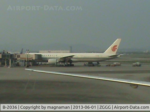 B-2036, 2012 Boeing 777-39L/ER C/N 38676, Shot from international departure lounge across apron. No access from here to domestic terminal without going through passport control backwards - not recommended!!