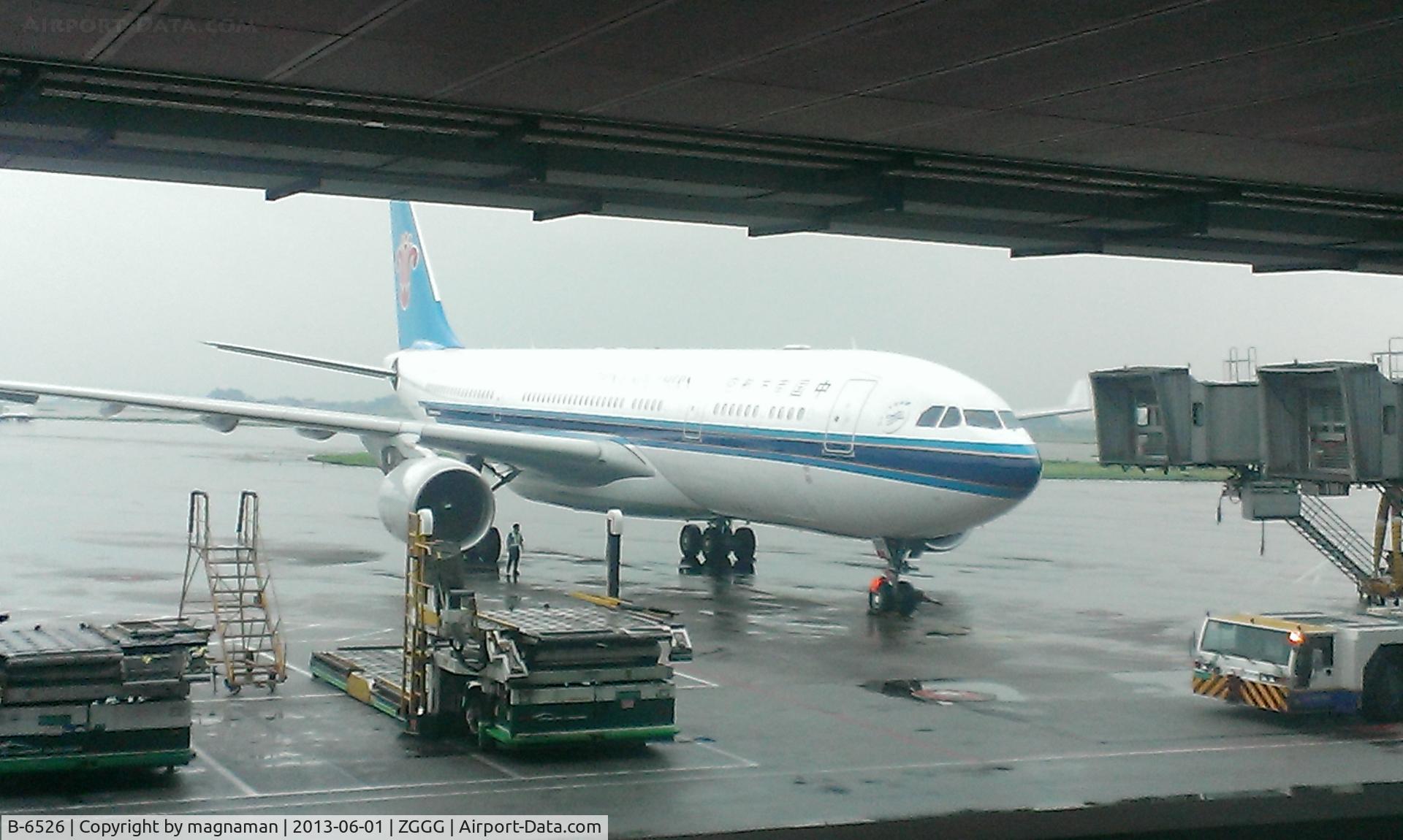 B-6526, 2011 Airbus A330-223 C/N 1220, From arrival corridor at lower level than departure lounge.