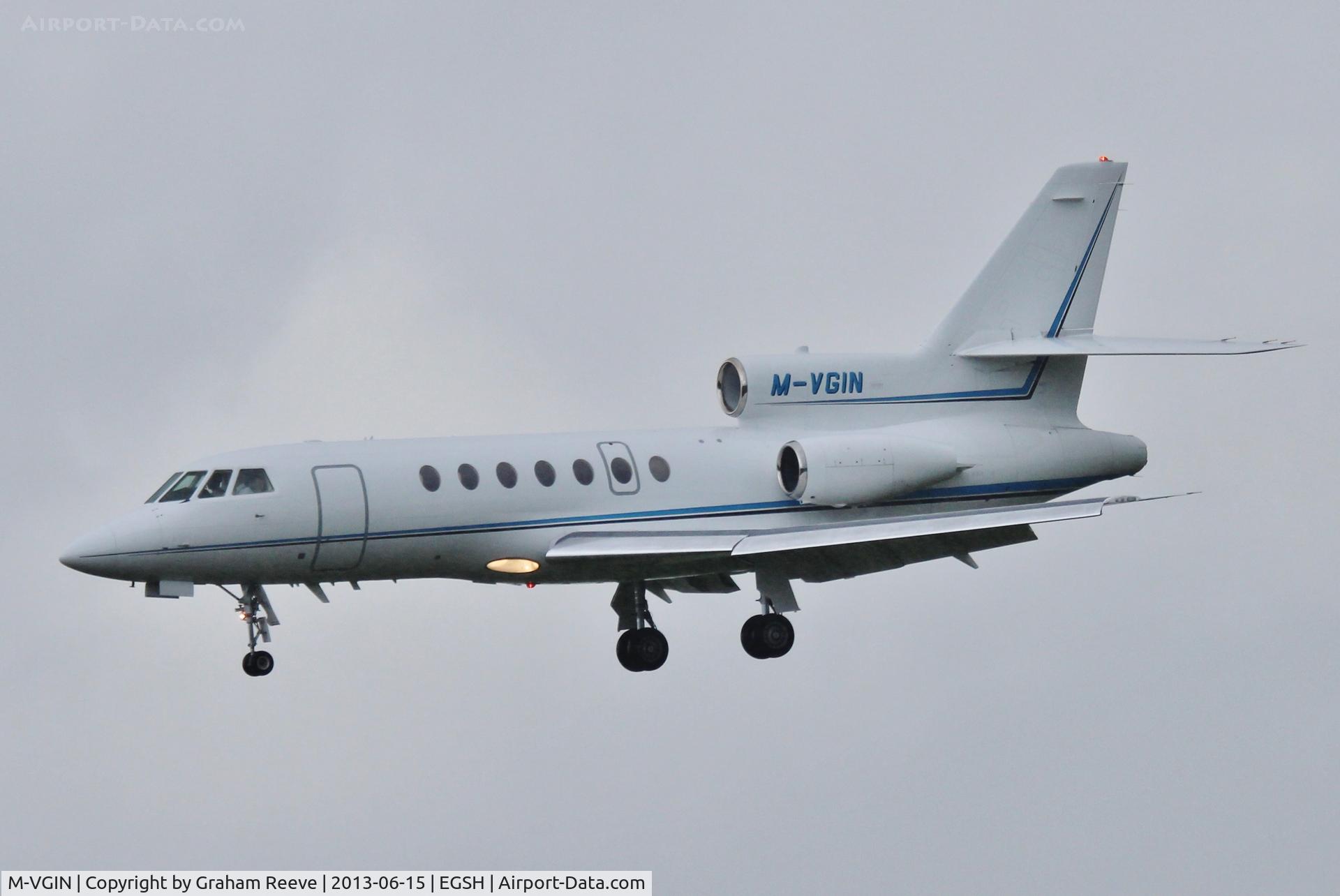 M-VGIN, 2001 Dassault Falcon 50EX C/N 320, About to land in heavy rain at Norwich.