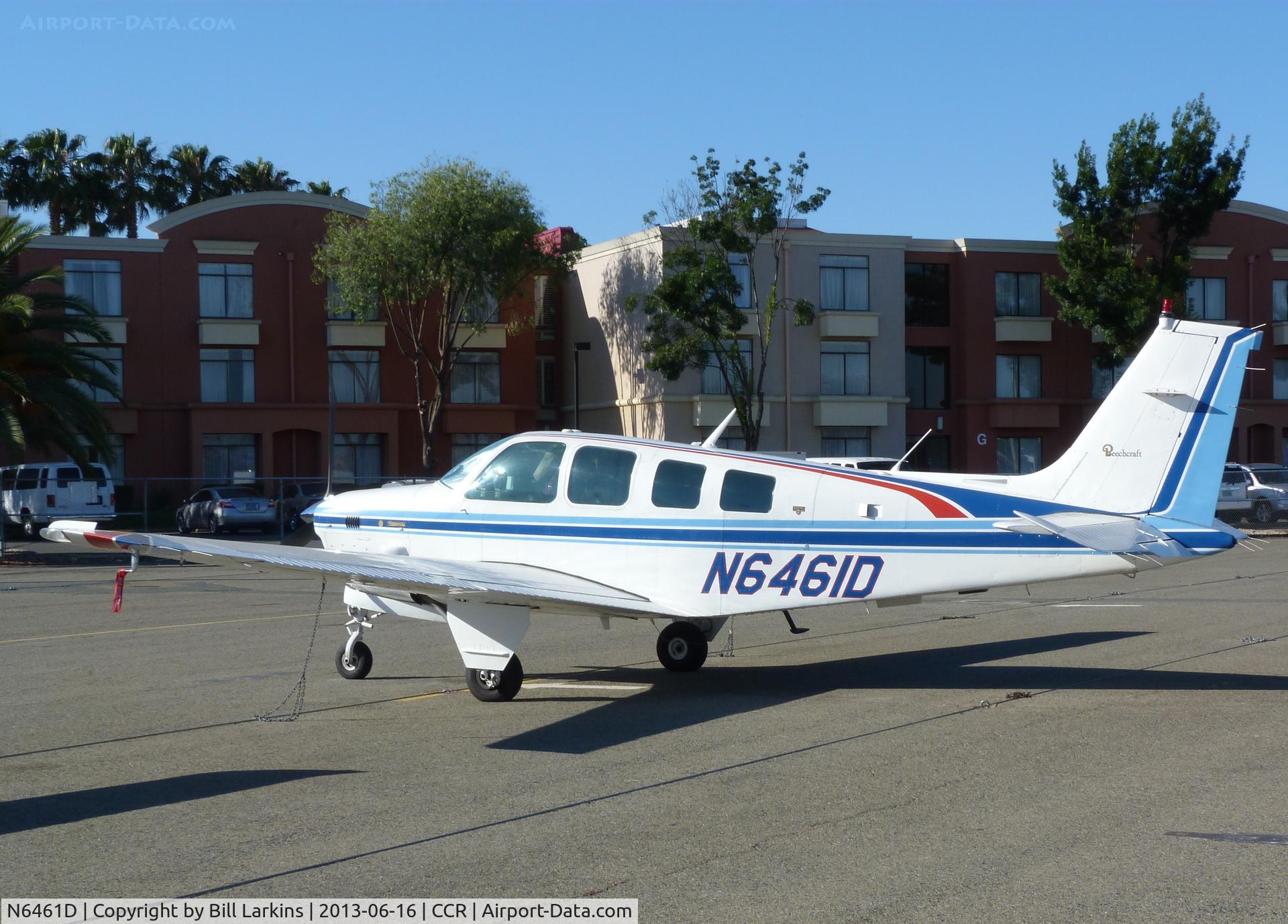 N6461D, 1982 Beech B36TC Bonanza C/N EA-287, Visitor with airport hotel in the background.