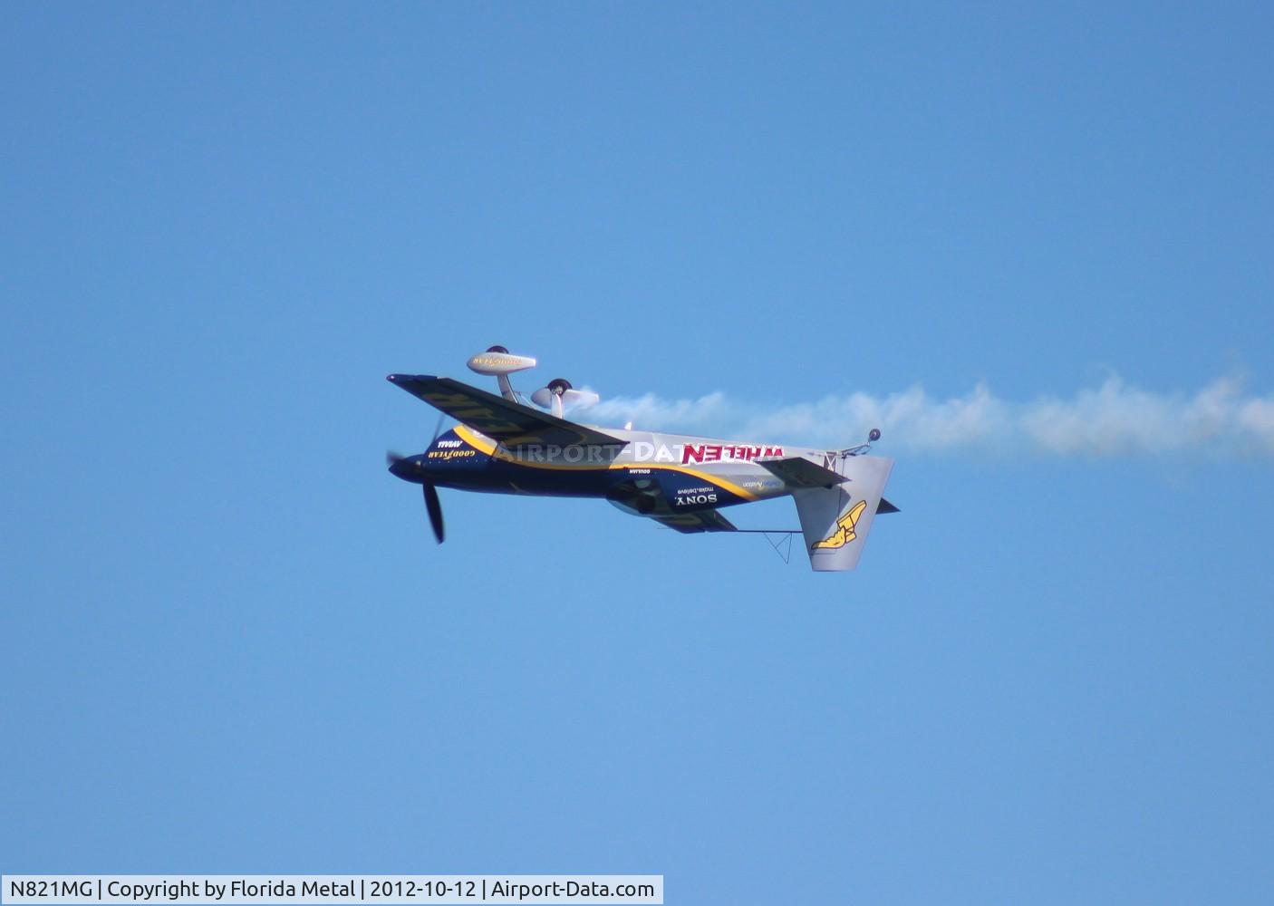 N821MG, 2009 Extra EA-300SC C/N SC010, Mike Goulian over Daytona Beach