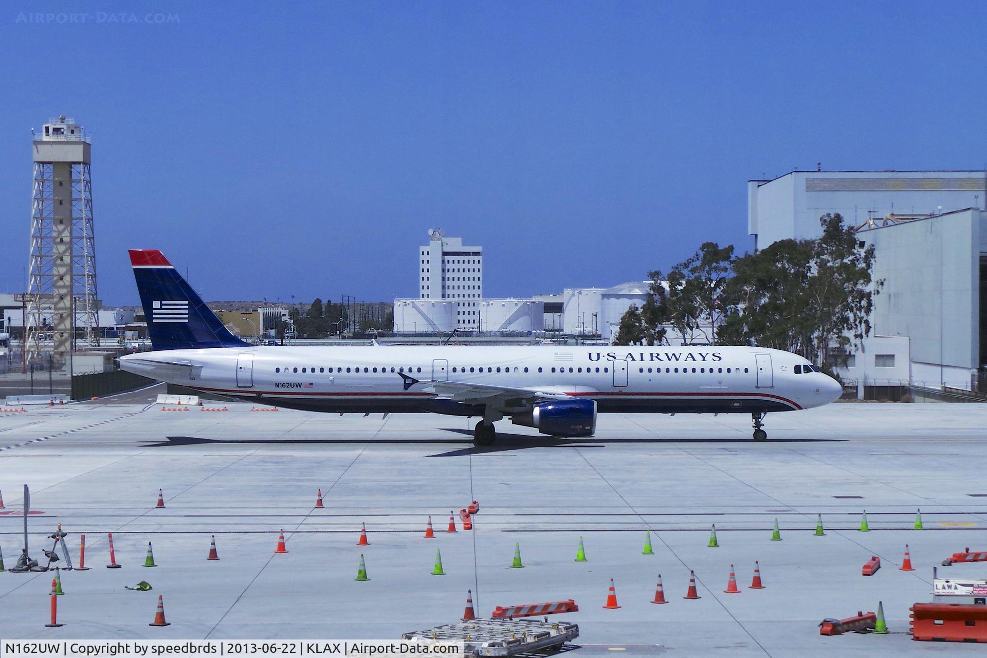 N162UW, 2001 Airbus A321-211 C/N 1412, US Airways A321-211 taxiing passed the new Tom Bradley International Terminal on 