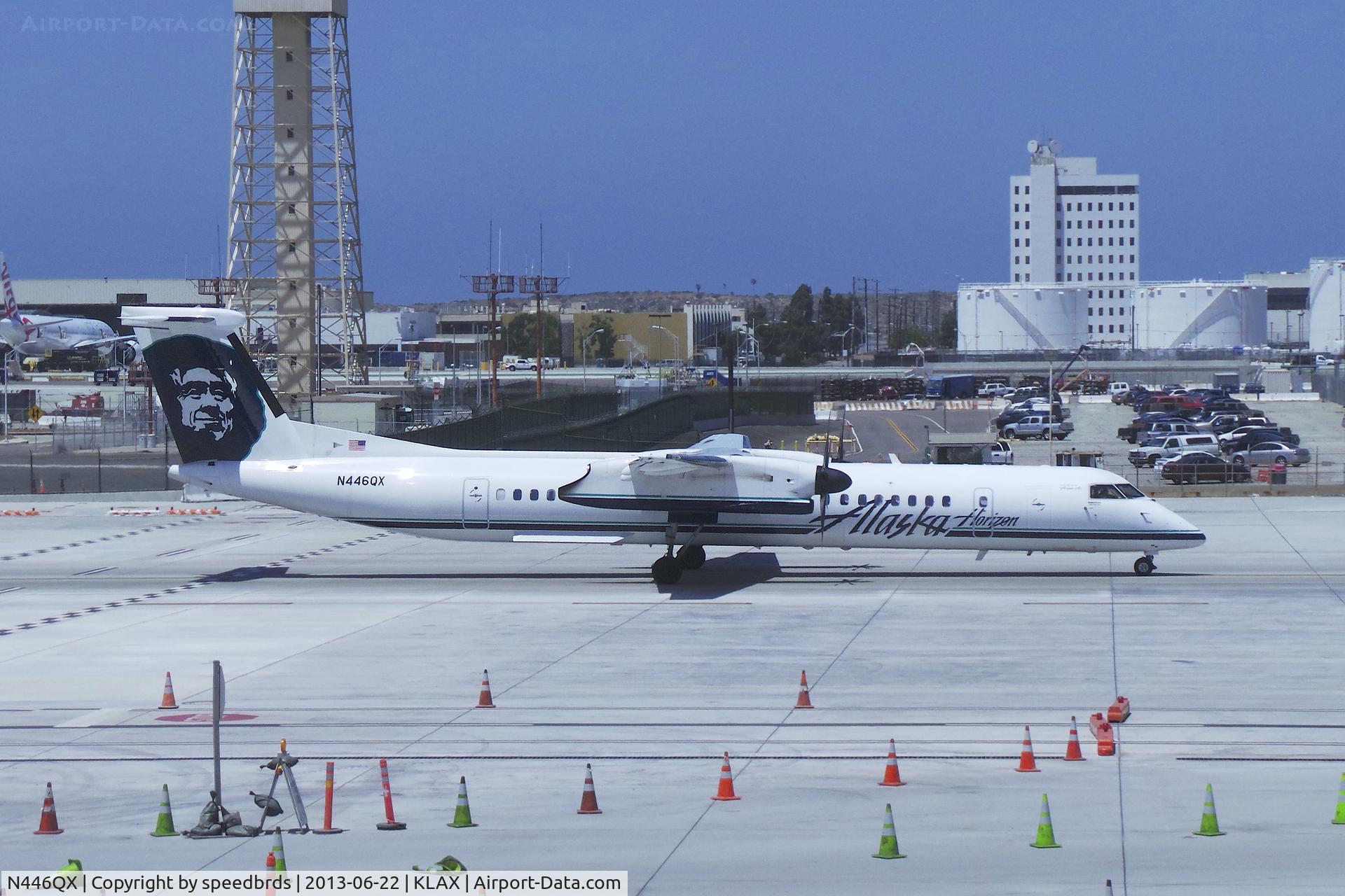 N446QX, 2011 Bombardier DHC-8-402 Dash 8 C/N 4363, Alaska Airlines (Horizon Airlines) Bombardier Dash 8 taxiing passed the new Tom Bradley International Terminal on 