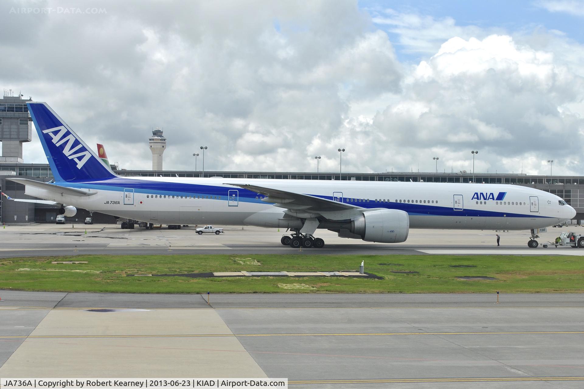 JA736A, 2006 Boeing 777-381/ER C/N 34893, Being unhooked after pushback
