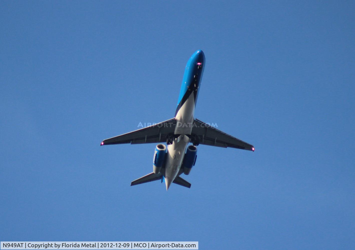 N949AT, 1999 Boeing 717-200 C/N 55003, Air Tran Orlando Magic belly shot as it flies over Orlando Executive Airport