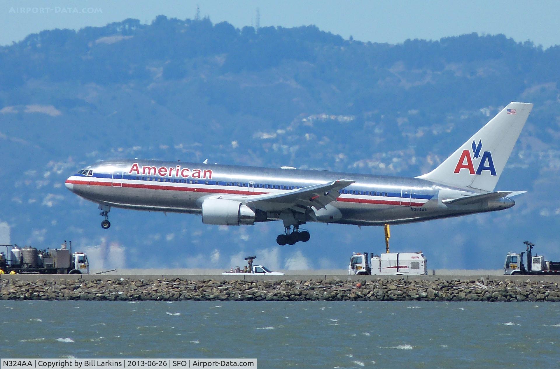 N324AA, 1986 Boeing 767-223 C/N 22325, Landing on Runway 28R as work continues on 28L.