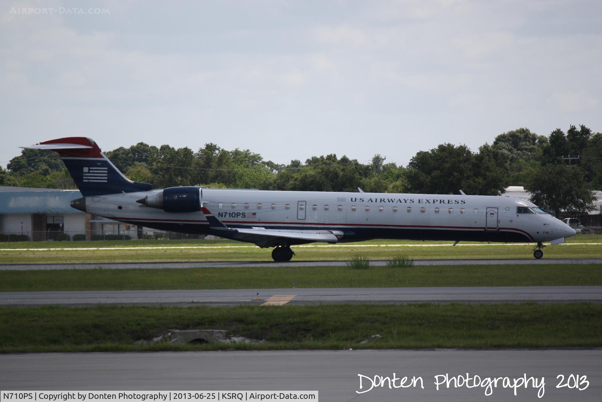 N710PS, 2004 Bombardier CRJ-701 (CL-600-2C10) Regional Jet C/N 10167, US Air Flight 2291 operated by PSA (N710PS) arrives at Sarasota-Bradenton International Airport following a flight from Charlotte-Douglas International Airport