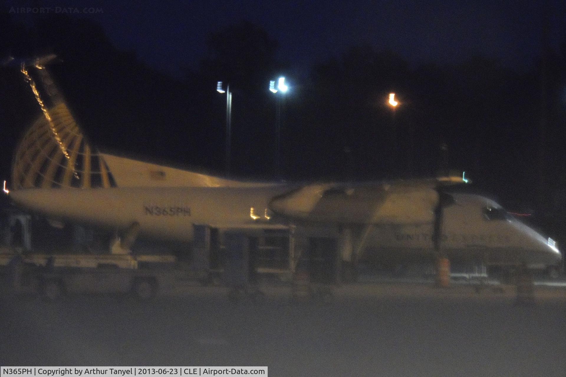 N365PH, 1998 De Havilland Canada DHC-8-202Q Dash 8 C/N 526, Sitting on tarmac @ CLE