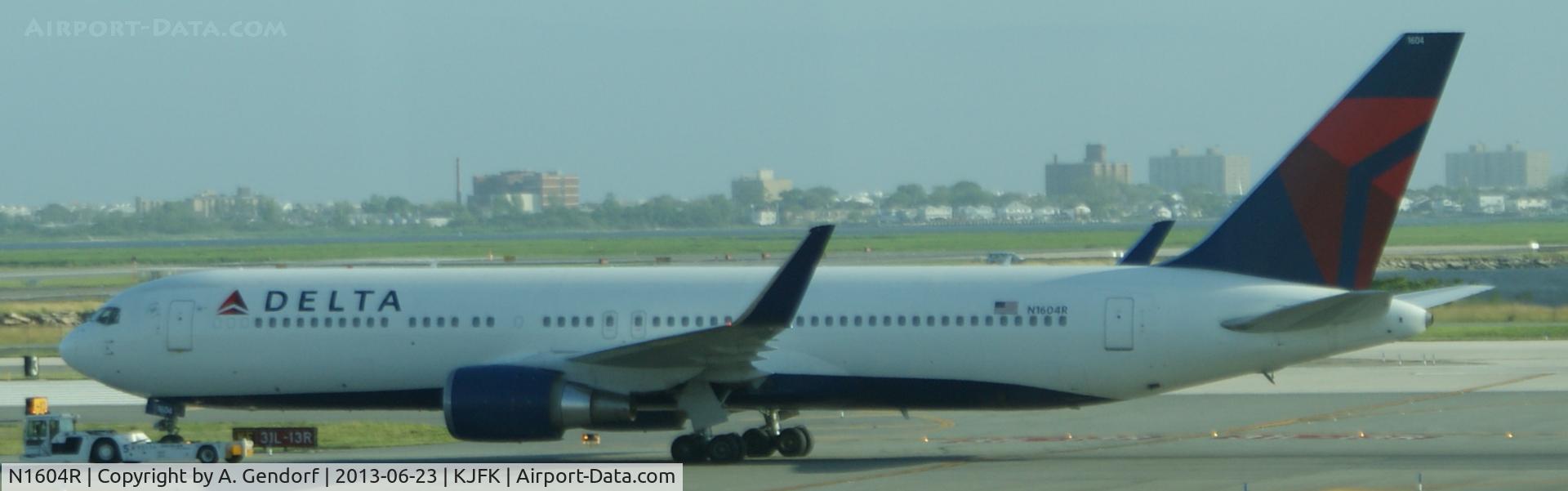 N1604R, 1999 Boeing 767-332 C/N 30180, Delta, is here towed to the gate for next flight at New York - JFK(KJFK)