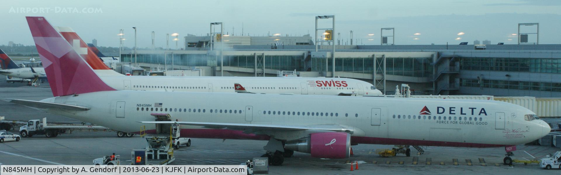 N845MH, 2002 Boeing 767-432/ER C/N 29719, Delta (pink cs. Breast cancer research foundation), seen here at the gate at New York - JFK(KJFK)