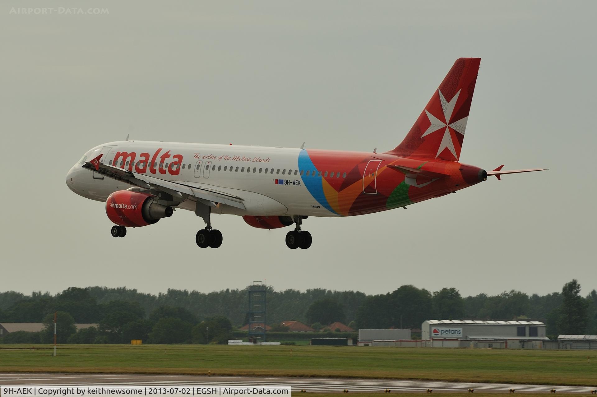 9H-AEK, 2004 Airbus A320-211 C/N 2291, About to touch down on runway 27.