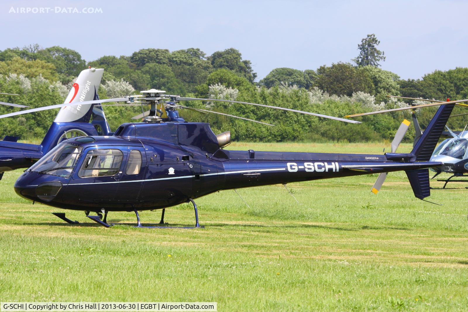 G-SCHI, 2000 Eurocopter AS-350B-2 Ecureuil Ecureuil C/N 3337, being used for ferrying race fans to the British F1 Grand Prix at Silverstone