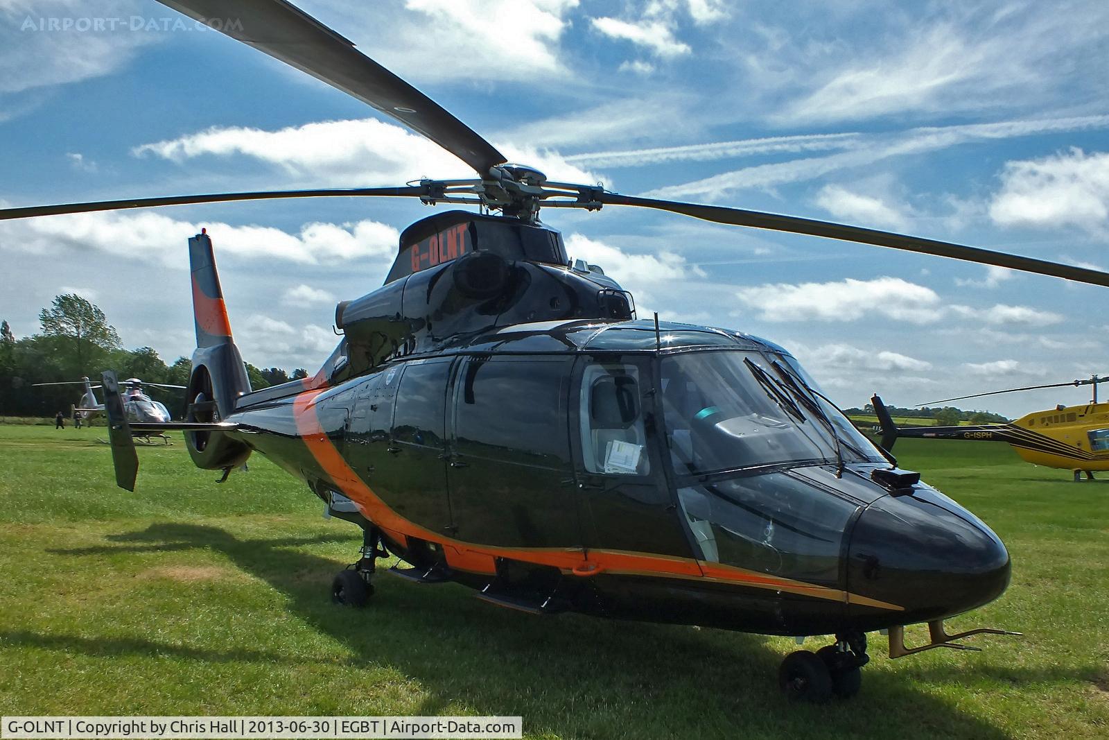 G-OLNT, 1988 Aérospatiale SA-365N-1 Dauphin 2 C/N 6309, being used for ferrying race fans to the British F1 Grand Prix at Silverstone
