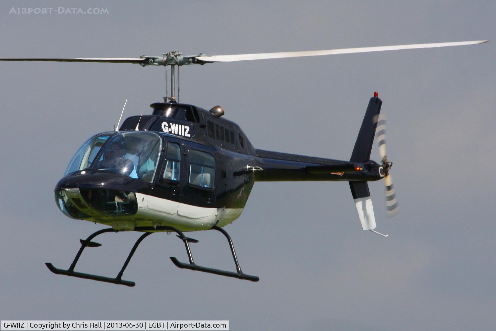 G-WIIZ, 1969 Agusta AB-206B JetRanger II C/N 8111, being used for ferrying race fans to the British F1 Grand Prix at Silverstone