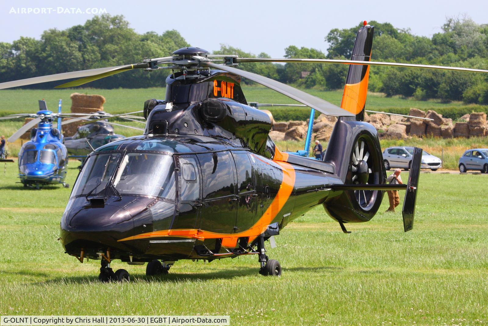G-OLNT, 1988 Aérospatiale SA-365N-1 Dauphin 2 C/N 6309, being used for ferrying race fans to the British F1 Grand Prix at Silverstone