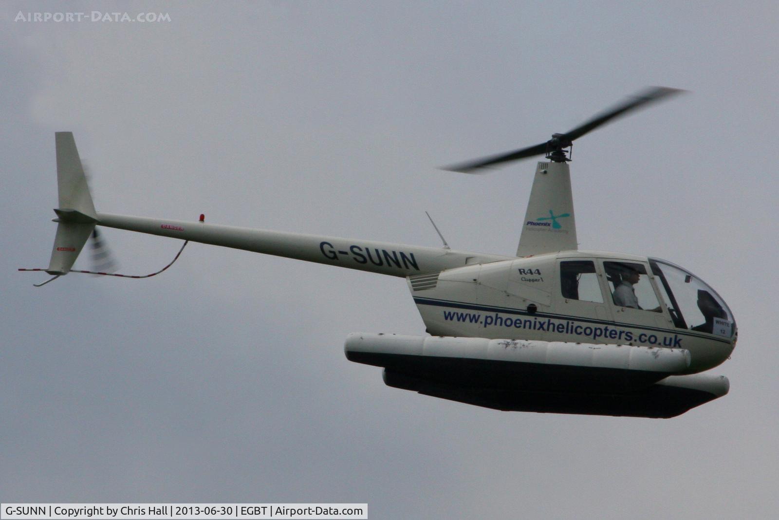 G-SUNN, 2004 Robinson R44 Clipper C/N 1367, being used for ferrying race fans to the British F1 Grand Prix at Silverstone