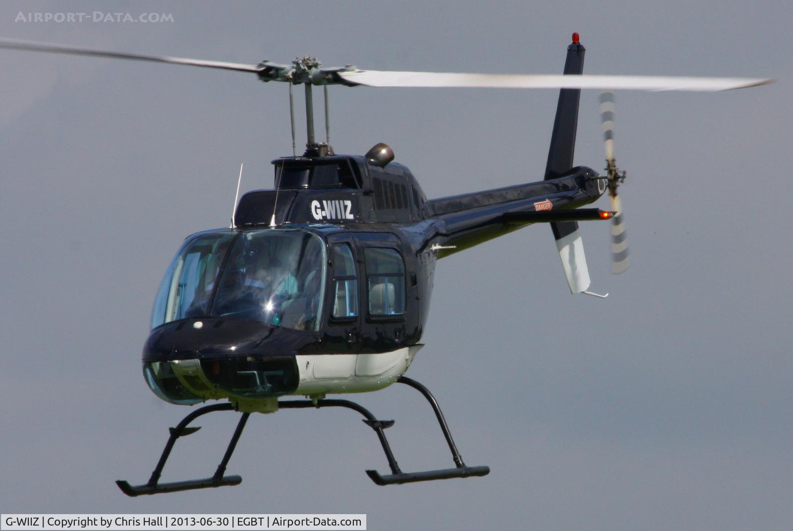 G-WIIZ, 1969 Agusta AB-206B JetRanger II C/N 8111, being used for ferrying race fans to the British F1 Grand Prix at Silverstone