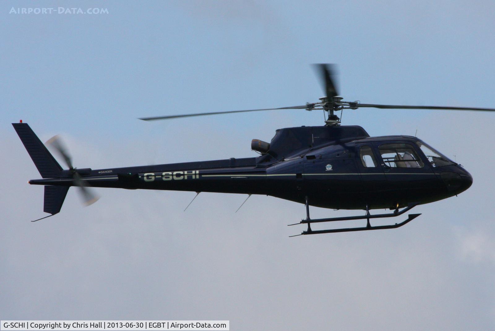 G-SCHI, 2000 Eurocopter AS-350B-2 Ecureuil Ecureuil C/N 3337, being used for ferrying race fans to the British F1 Grand Prix at Silverstone