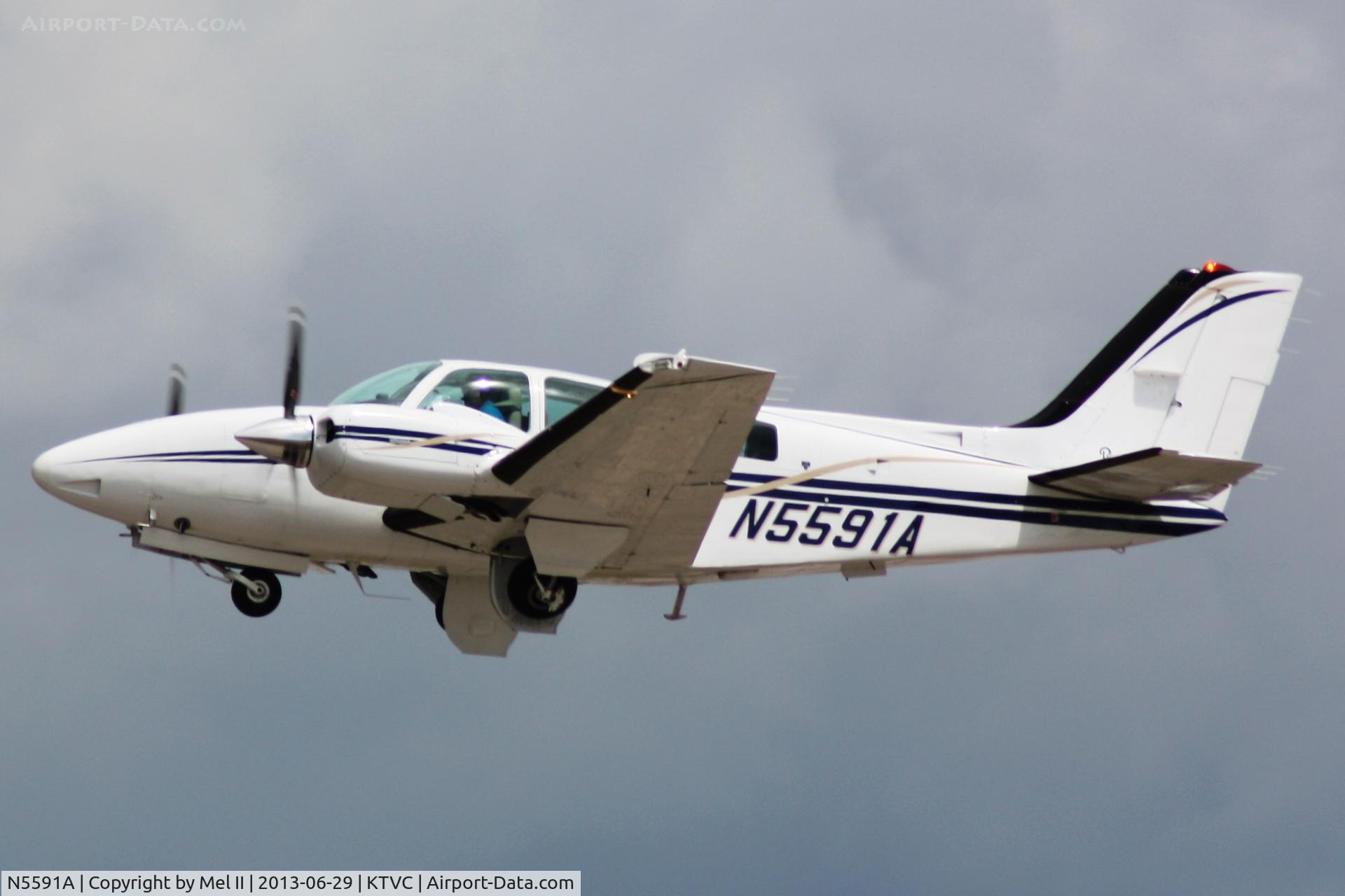 N5591A, 1989 Beech 58 Baron C/N TH-1566, KTVC-KIMT - Departing RWY 36