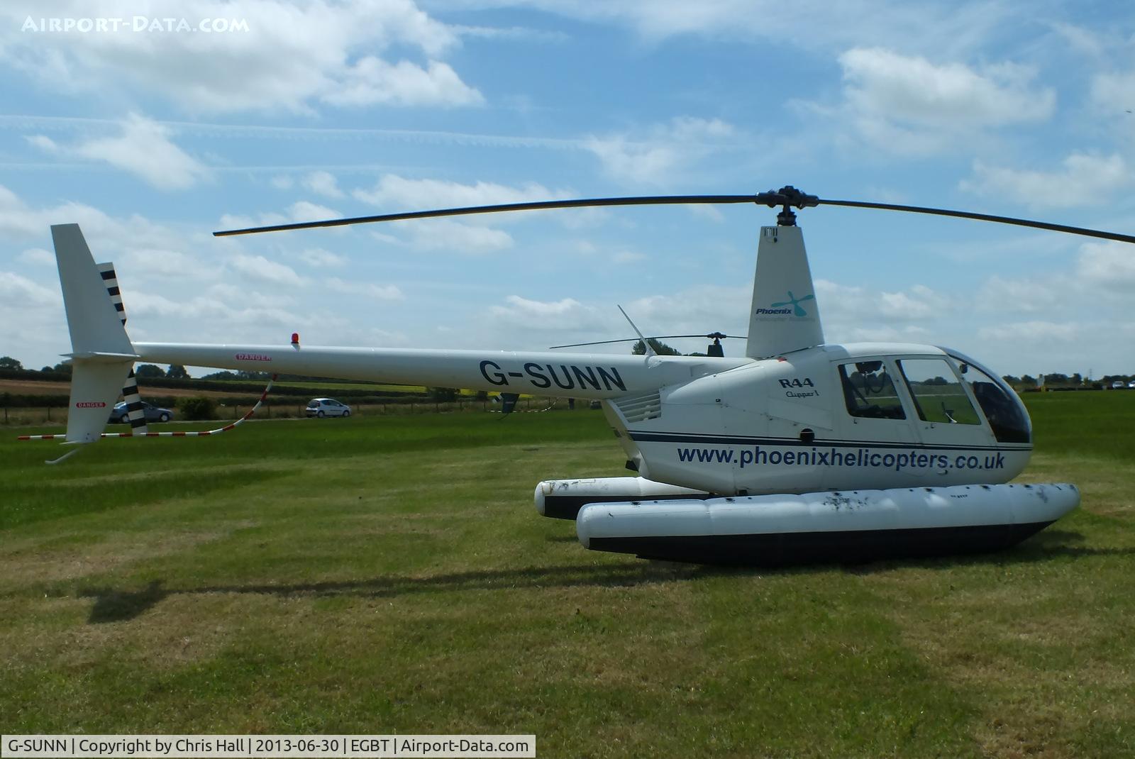 G-SUNN, 2004 Robinson R44 Clipper C/N 1367, being used for ferrying race fans to the British F1 Grand Prix at Silverstone