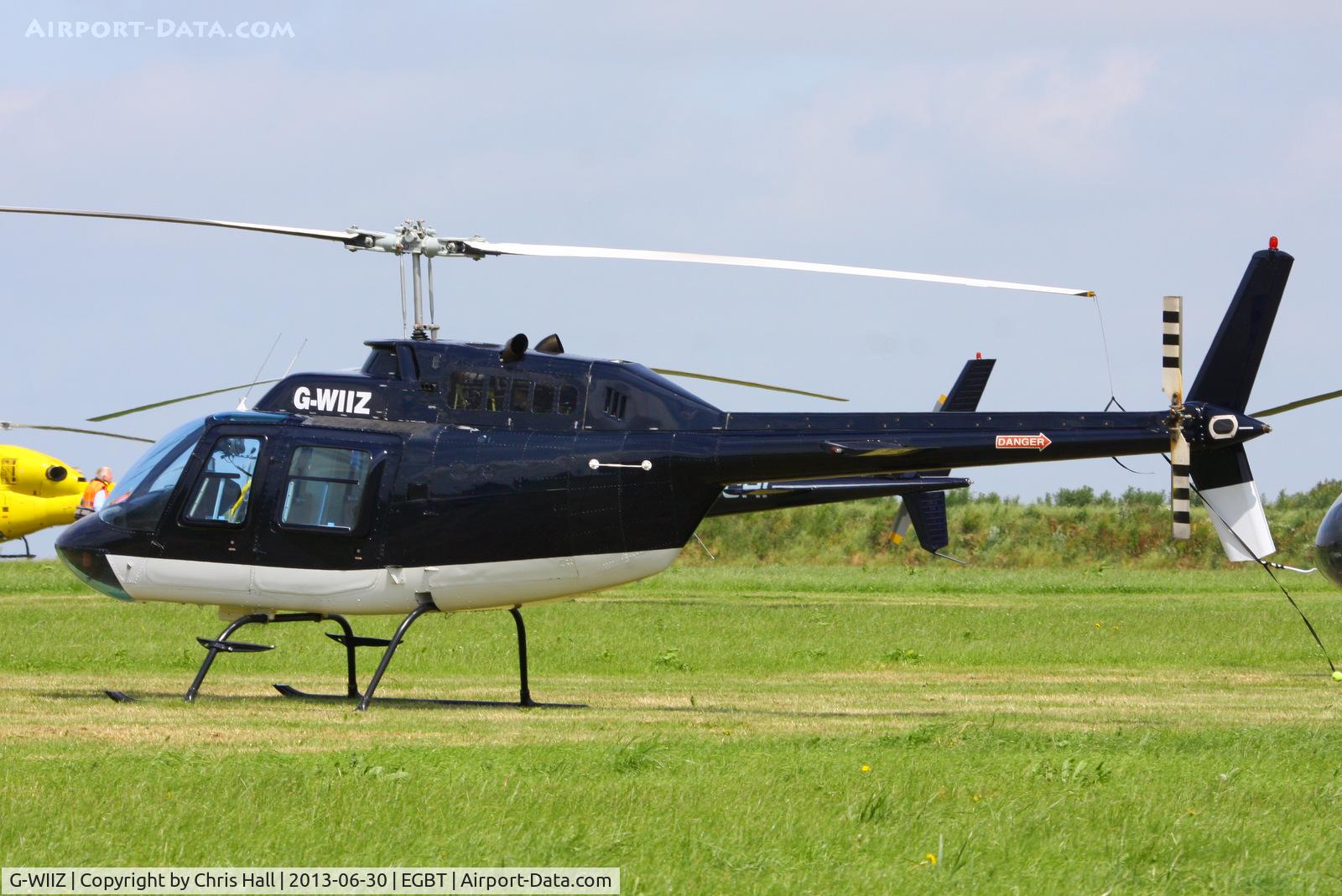 G-WIIZ, 1969 Agusta AB-206B JetRanger II C/N 8111, being used for ferrying race fans to the British F1 Grand Prix at Silverstone