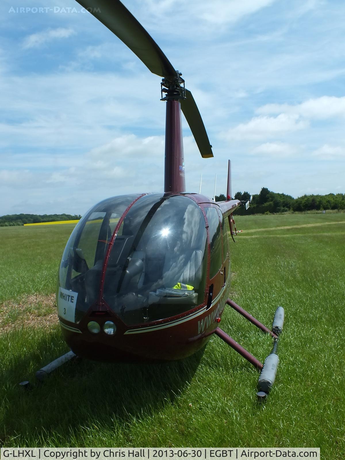 G-LHXL, 2007 Robinson R44 Raven C/N 1702, being used for ferrying race fans to the British F1 Grand Prix at Silverstone