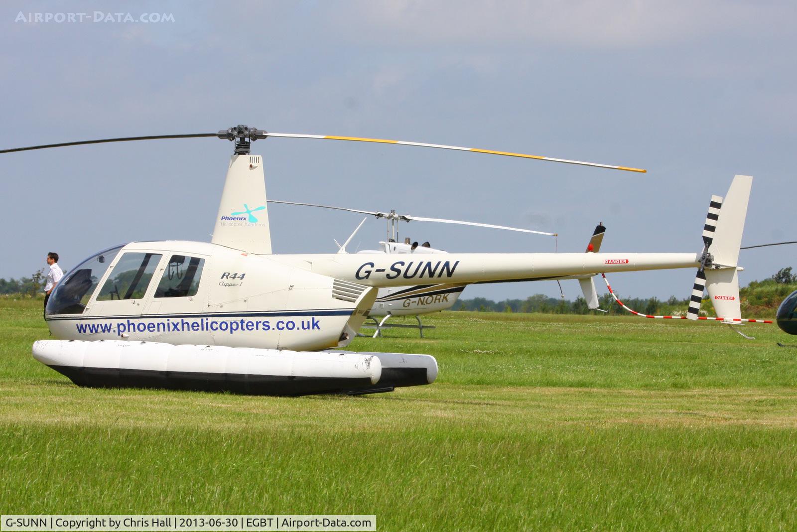 G-SUNN, 2004 Robinson R44 Clipper C/N 1367, being used for ferrying race fans to the British F1 Grand Prix at Silverstone